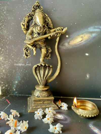 Lord Ganesha with Veena dancing on a Snake